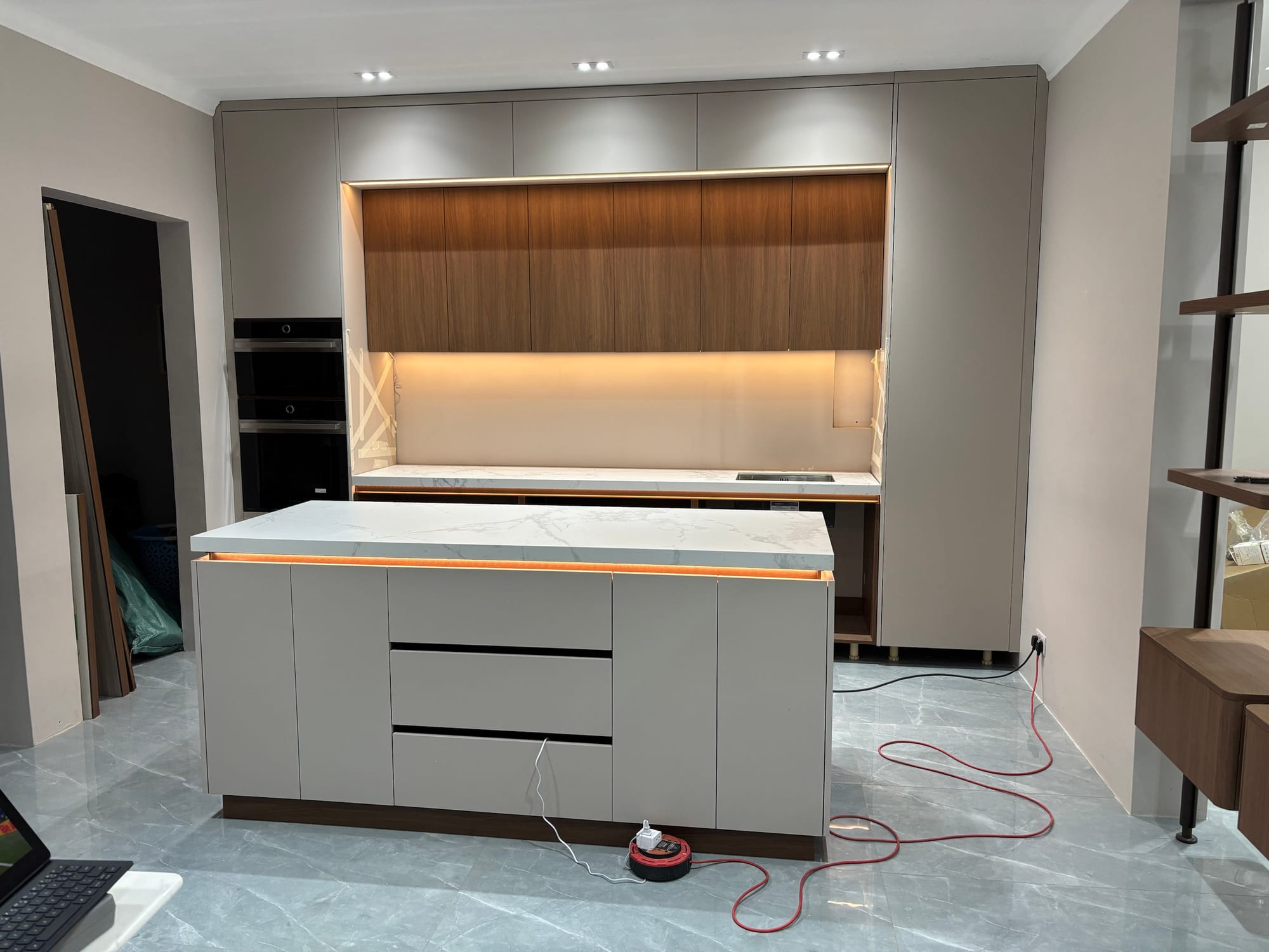 Finished kitchen cabinetry and island in a renovated home in Mauritius